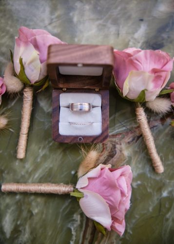 wedding rings surrounded by wedding favours. 