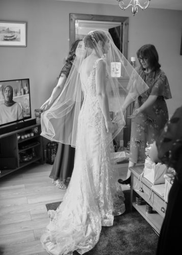 Bride getting ready at home with family 